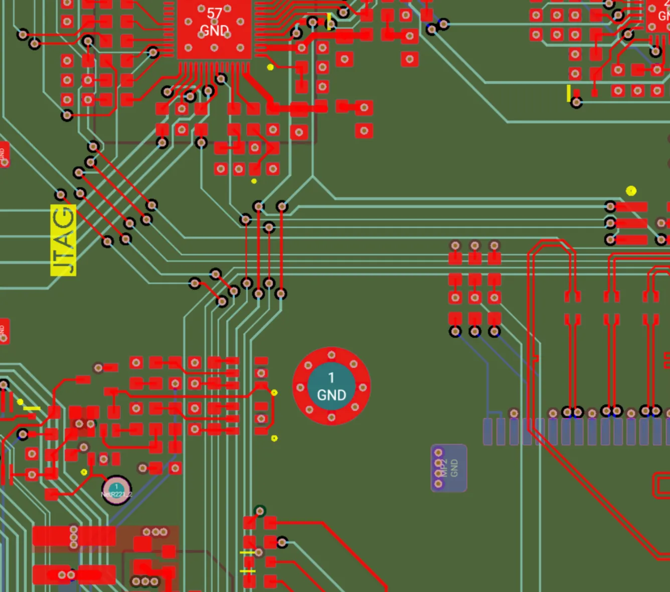 Detail of a multilayer PCB layout with a JTAG header and ground vias