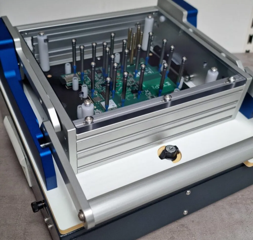 ATNET test rig with a bed-of-nails fixture and pogo pins, lid open